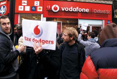 image: fair tax protestors vodaphone tax avoidance sign vidaphone tax dodgers