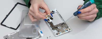 Person repairing a Fairphone mobile phone