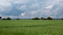 image: ecotricity energy wind turbines in a lush green field