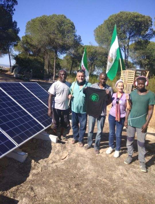 Solar panels in southern Spain with migrant workers