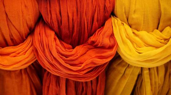 image: ethical cloth colourful dye fabrics in a row
