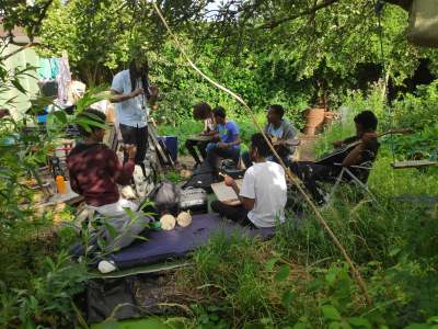 Image: young refugees learning music