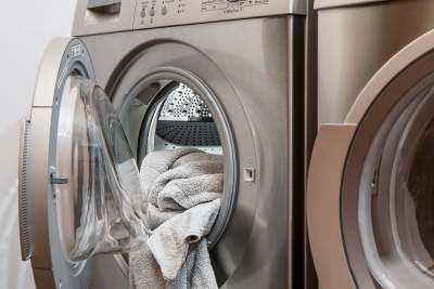 Washing machine with towel inside and open door