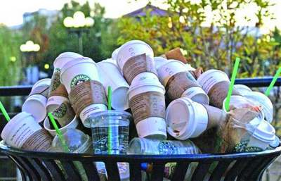 Bin full of Starbucks disposable coffee cups