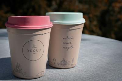 Two reusable hot drink takeaway cups