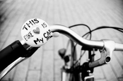 Black and white image of bike bell which says 'this bike is my car'