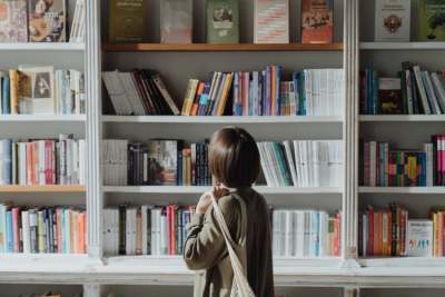 Woman looking at shelves of books