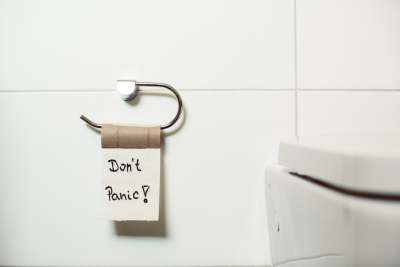 Picture of last sheet of toilet paper with 'Don't panic' written on it