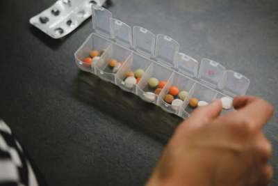 7-day pill box with tablets inside each section