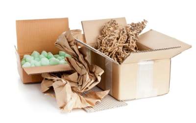 Open cardboard boxes with various types of packaging material 