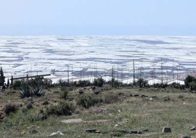Landscape of white polytunnels plastic looks like snow