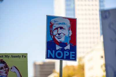 Sign with picture of Trump's face and the word 'nope'