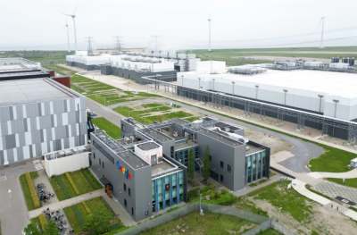 Aerial view of Google's data centre in The Netherlands, large buildings on flat land