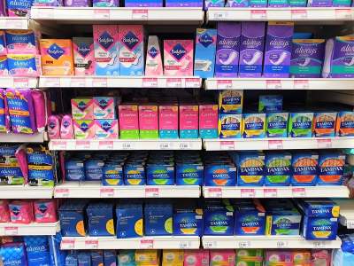 Shelves of period products in shop