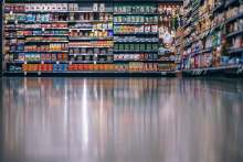 Image: supermarket floor reflects masses of supermarket products