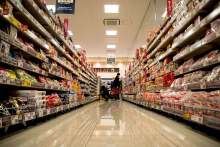 Image: supermarket aisle reflects lots of food products