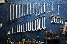 Tools and spanners hanging on wall