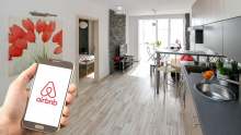 Interior of modern apartment with airbnb logo