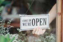 Sign in shop door 'Come in we are open'