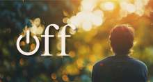 View of back of someone's head and back, sitting in dappled sunlight in woods, with the word 'off' overlaid, with the 'o' as the symbol for power button