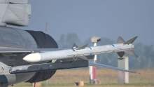 Military airplane with missile on the side