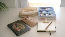 Notepad, pens and stationery on table