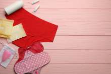 Different menstrual period products like pants, pads, cup, disposable pads, tampons
