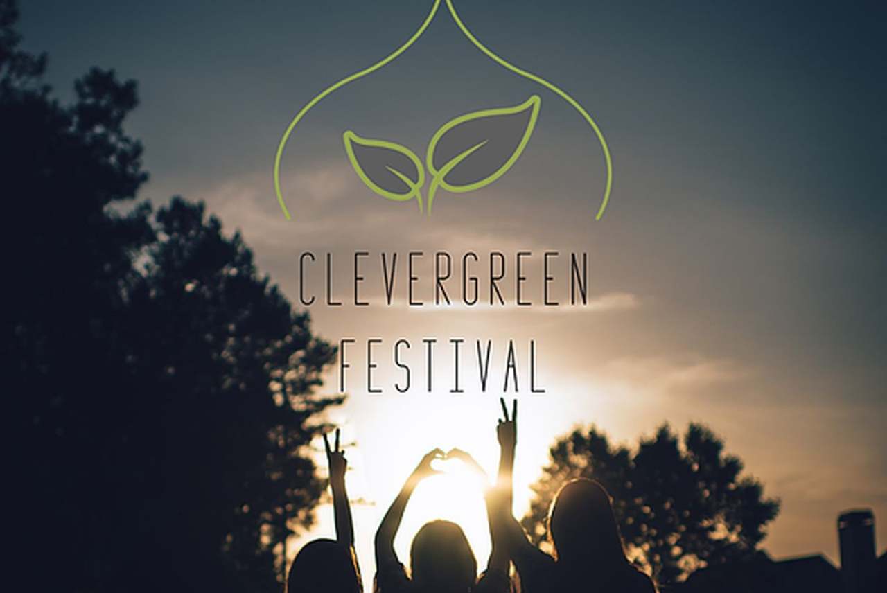 Image: clevergreen festival brighton girls silhouetted in the sun below the logo
