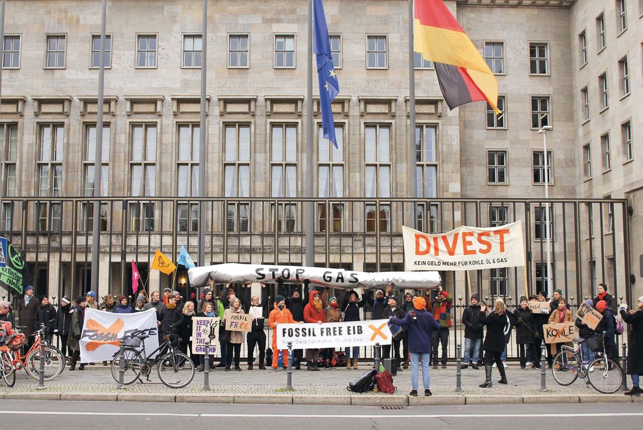 image: divest EIB berlin strike flags