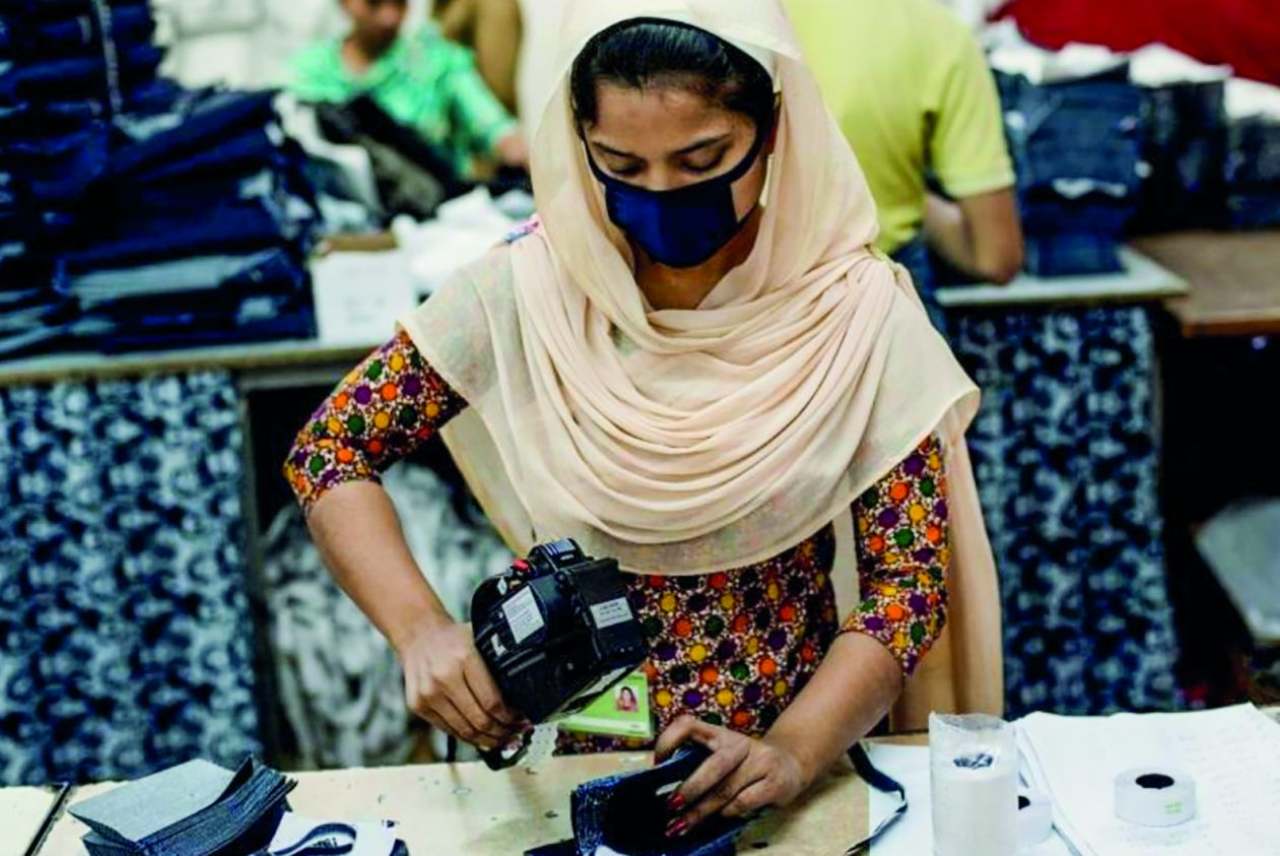 Garment worker wearing a face mask