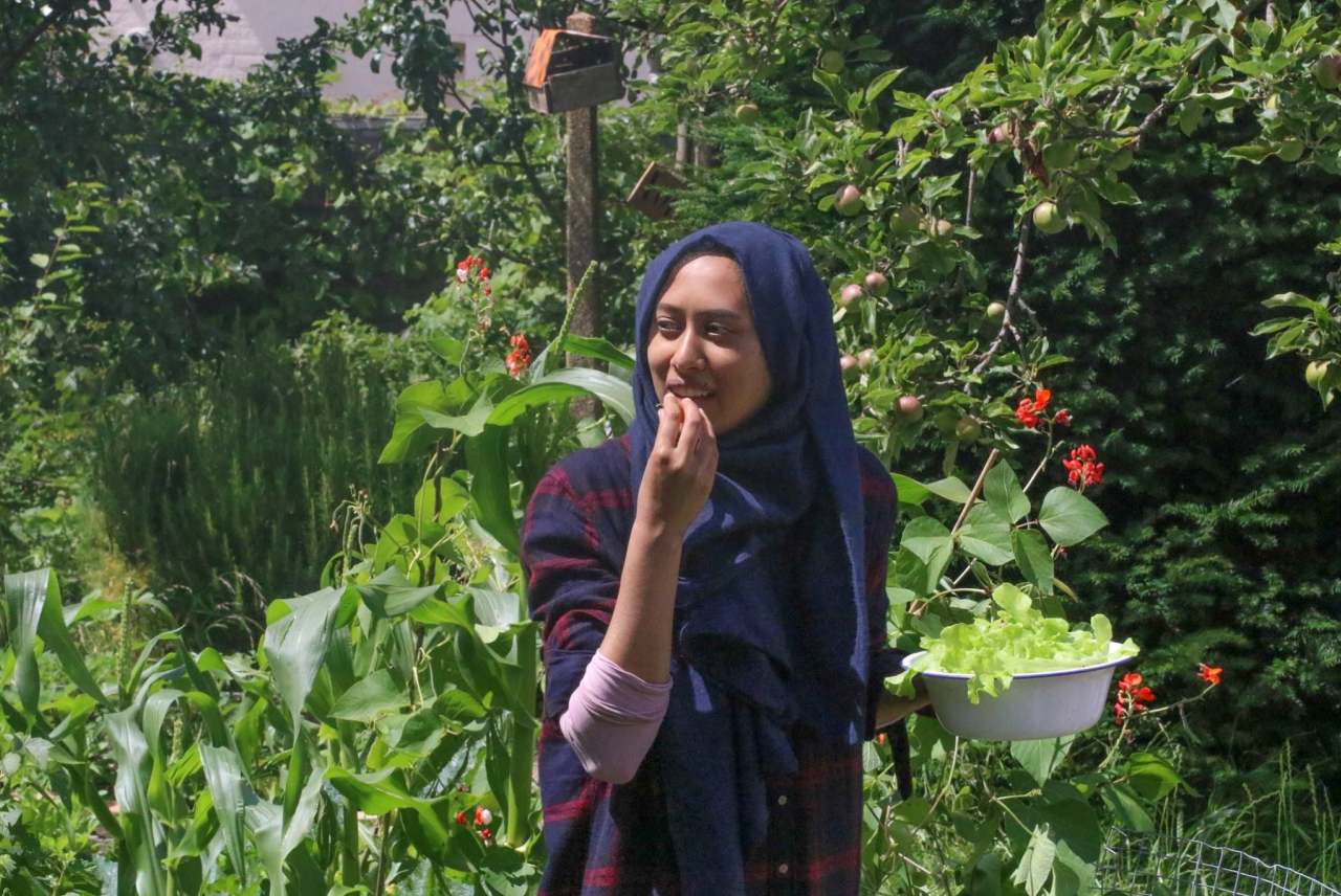 A young participant in a workshop at the May Project Gardens.