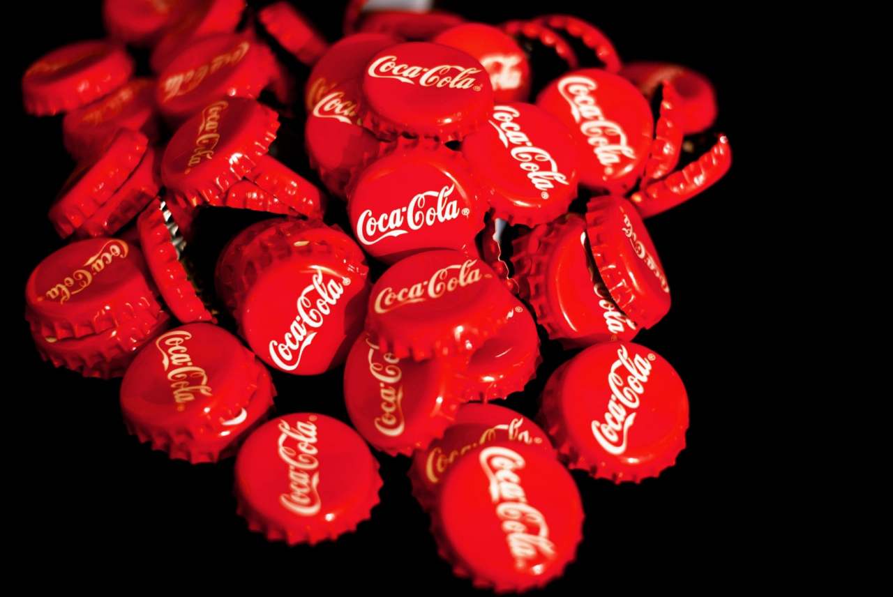 image: pile of red coca cola lids