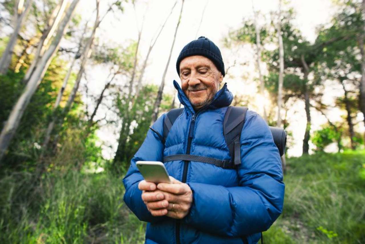 Man in forest with mobile phone