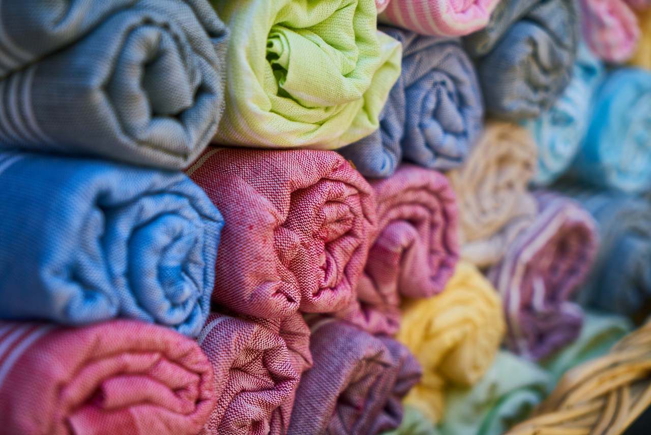 Rolls of cloth fabric of different colours