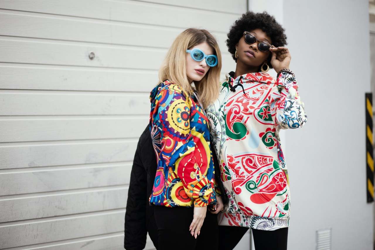 Two women wearing patterned clothes
