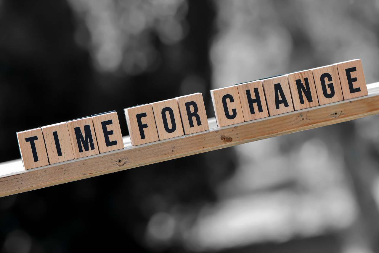 Scrabble letter tiles spell out 'Time for Change'