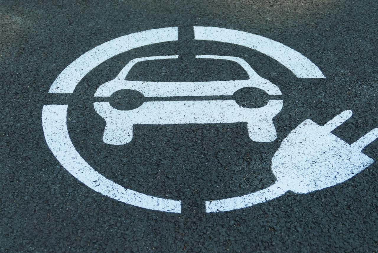 electric car charging logo painted on tarmac