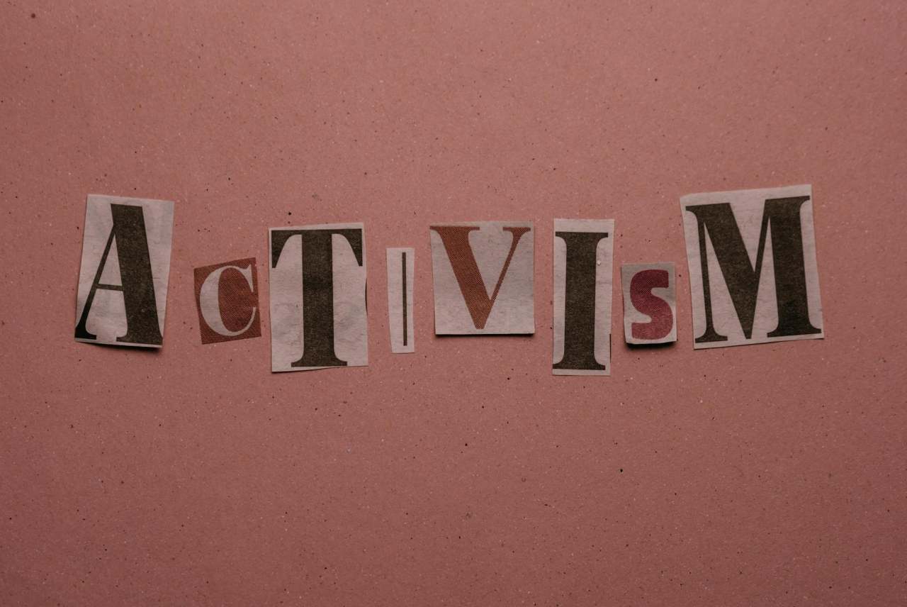 Letters cut out of newspaper to spell activism