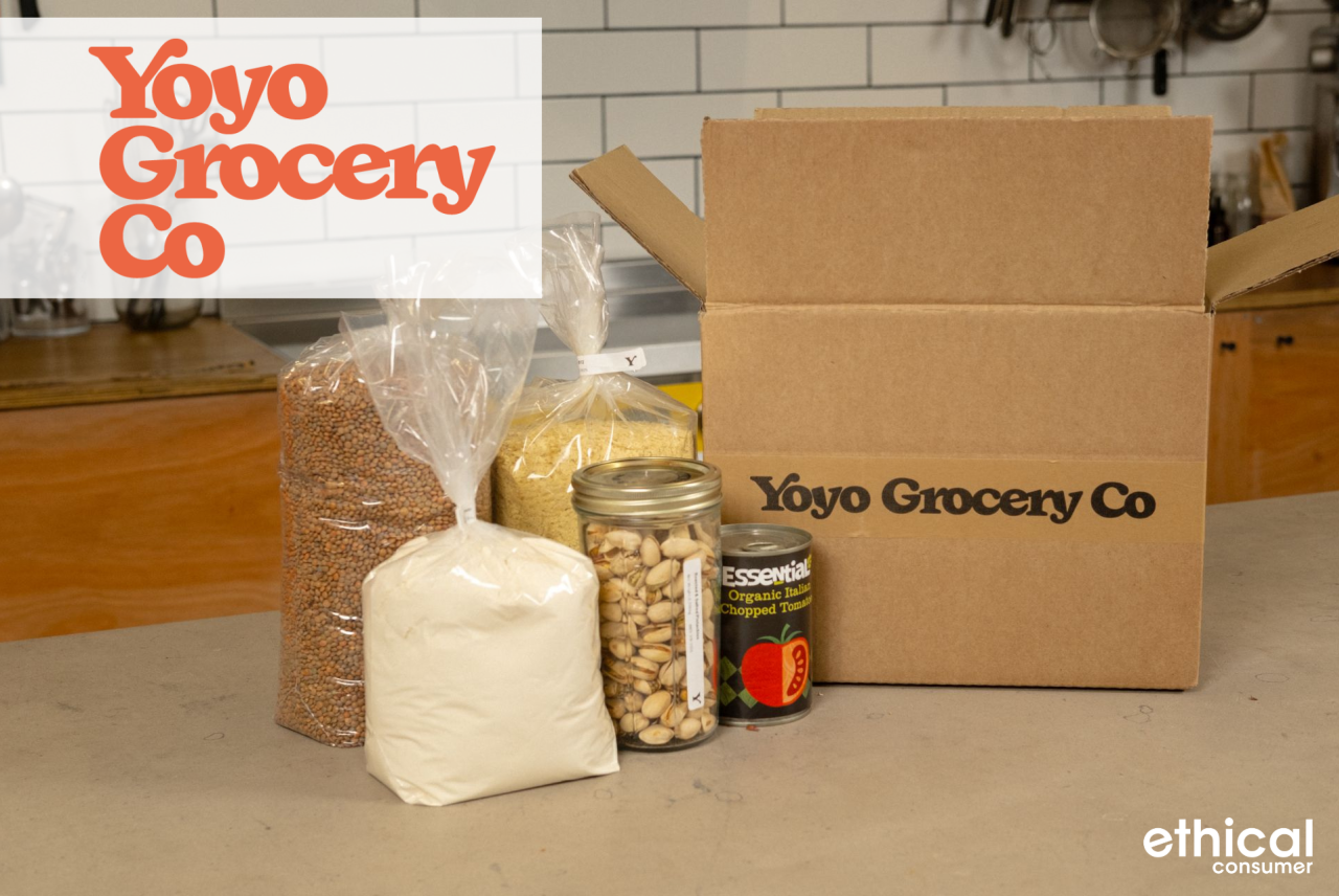 Box of food on counter in kitchen with bags of dried products in front of box
