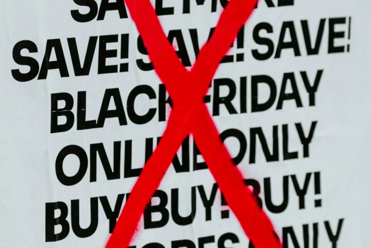 Black Friday sales poster with a big red cross through it