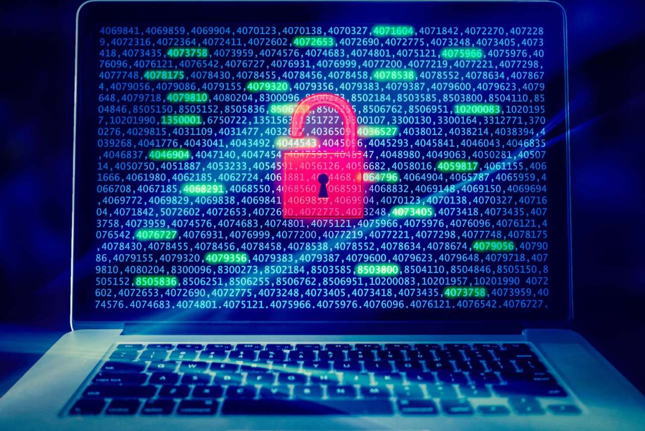 Laptop with numbers code on screen and image of red padlock