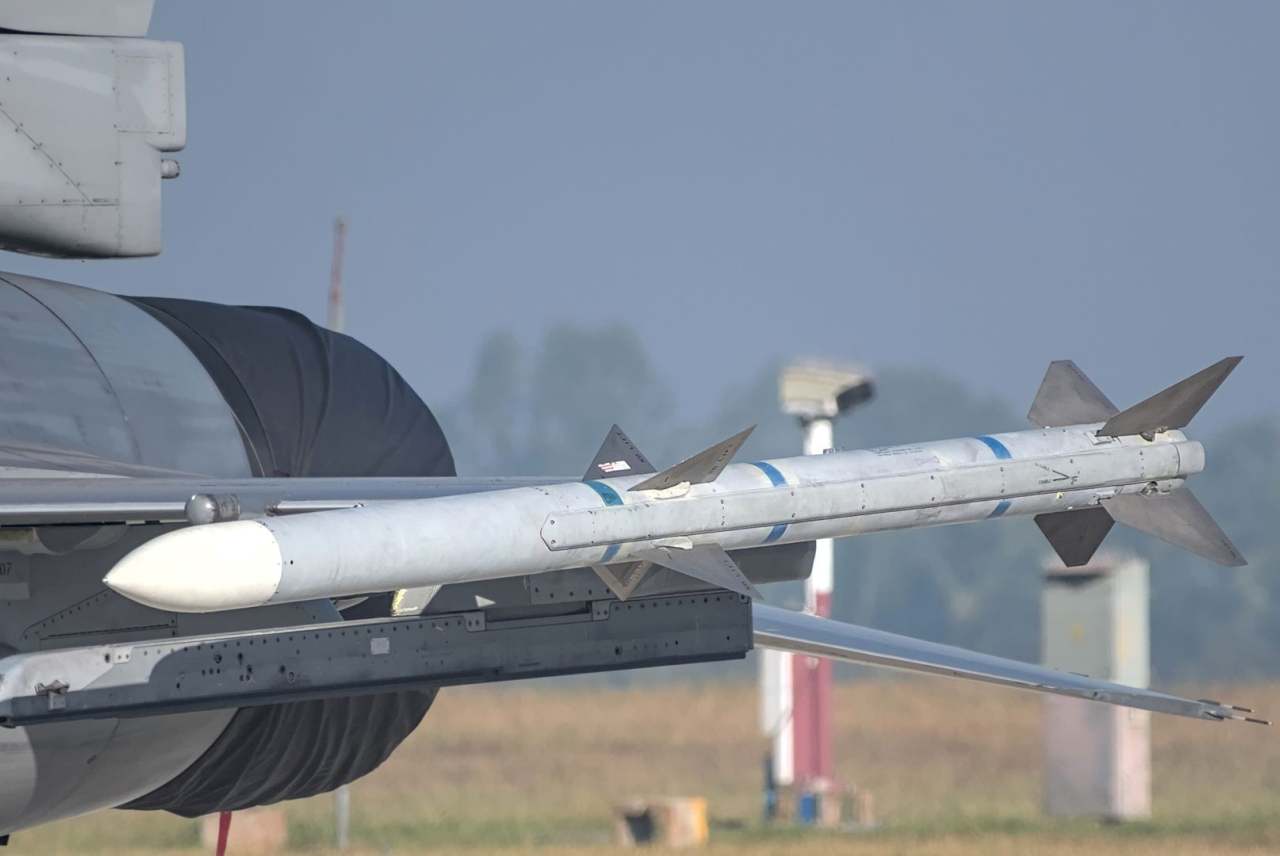 Military airplane with missile on the side