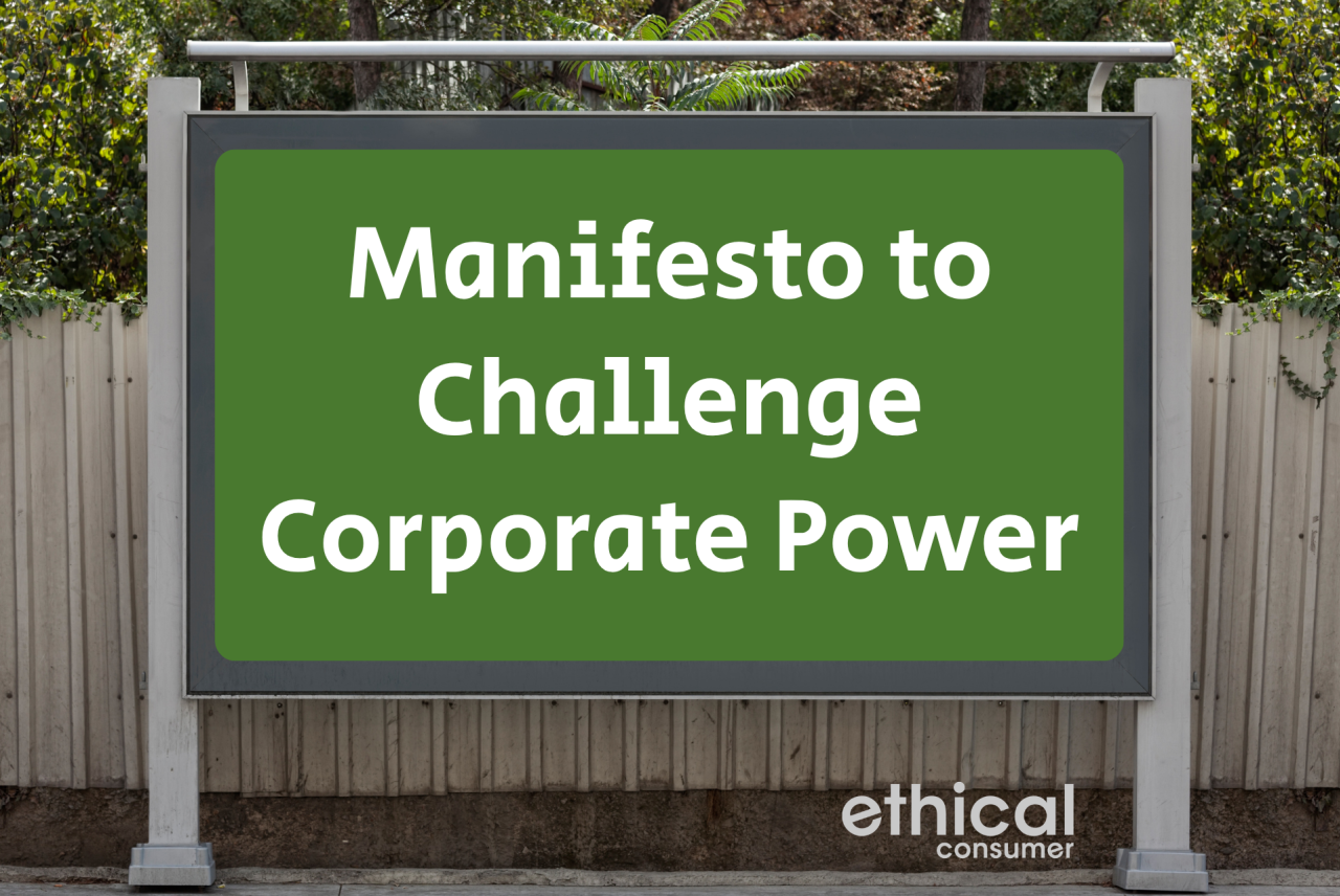 Billboard on street with words 'manifesto to challenge corporate power'