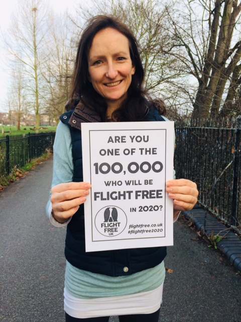 Image:anna hughes flight free 2020 holding up poster