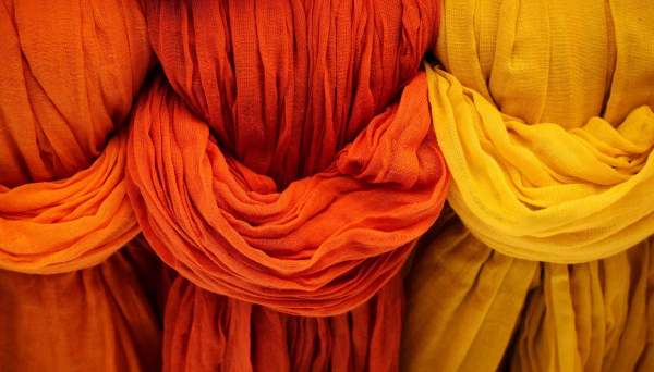 image: ethical cloth colourful dye fabrics in a row
