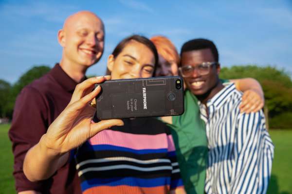 Group of people holding Fairphone