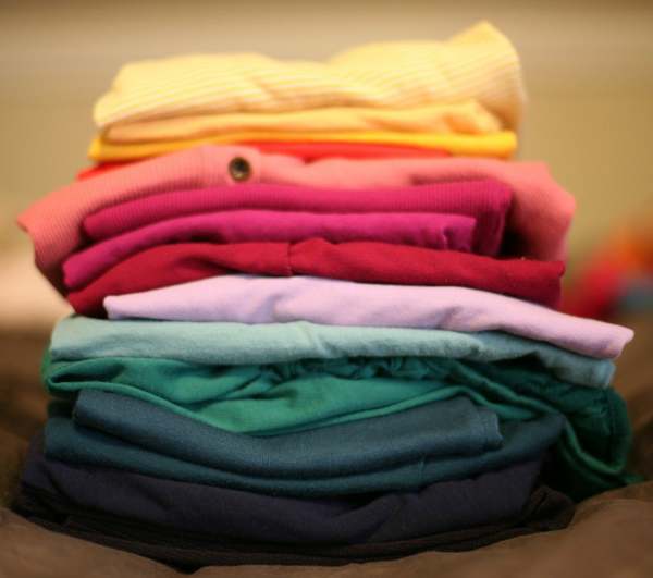 Pile of folded clothes of different colours