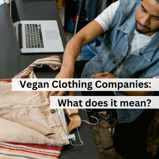 Man at desk with clothes on hangers