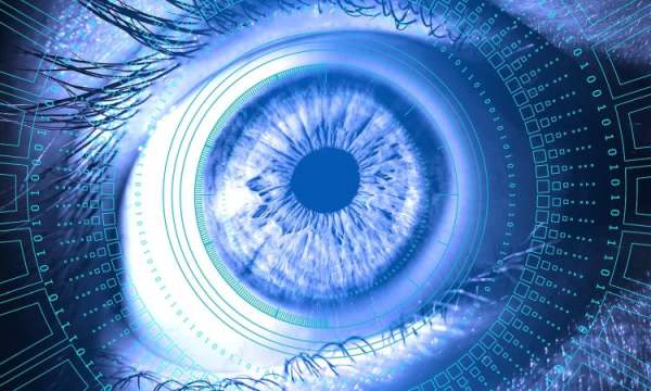 Image of eyeball surrounded by computer code